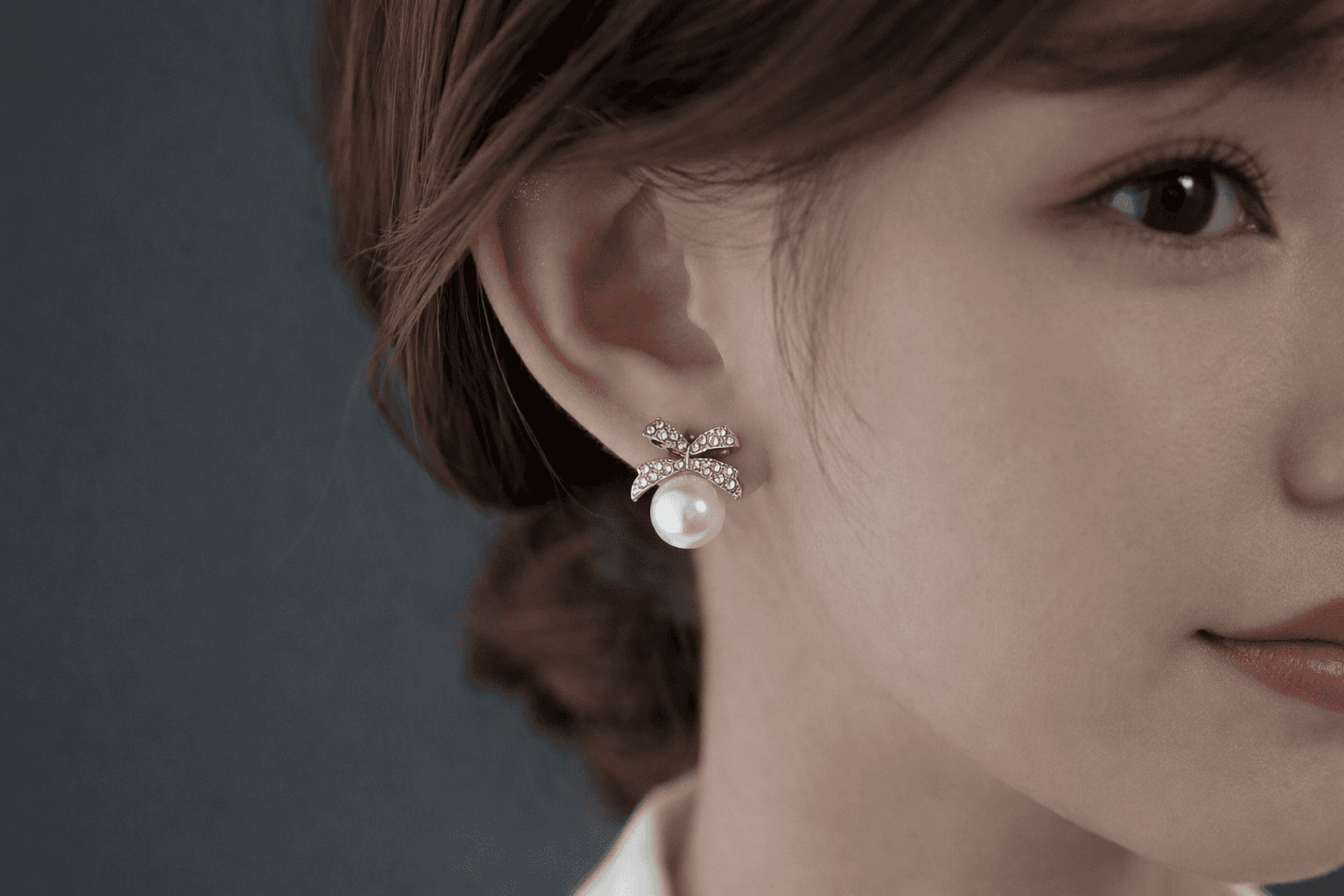 Gold Toned Bow Pearl Stud Earrings with American Diamonds